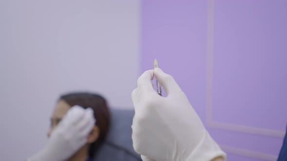 Patient with Ice Pack on Her Face to Reduce Pain From Botox Injections