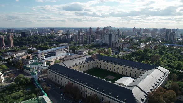 Aerial View of Metropolis City Skyline with Skyscrapers Green Trees and Sky