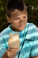Lifestyle portrait of child enjoying vanilla smoothie at summer vacation  - PhotoDune Item for Sale