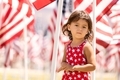 Candid portrait of toddler girl celebrating 4th of July in the park - PhotoDune Item for Sale