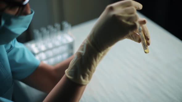 Doctor holding a coronavirus COVID-19 test tube