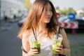 Young asian girl holding two organic smoothies  - PhotoDune Item for Sale