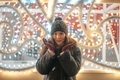 Portrait of a young girl enjoying Christmas time and Christmas lights and decoration - PhotoDune Item for Sale