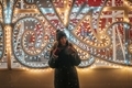 Girl standing in front of street Christmas illumination  - PhotoDune Item for Sale
