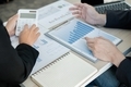 Two business leaders talk about charts, financial graphs showing results are analyzing  - PhotoDune Item for Sale