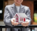 Agents working in real estate investing Agents' hands hold homes to protect the safety of customers - PhotoDune Item for Sale