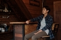 A young Asian man sits at the bar counter in a restaurant to relax - PhotoDune Item for Sale
