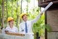 Team of male and female engineers and architects, working team, meeting, discussing construction - PhotoDune Item for Sale