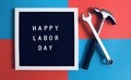 Happy Labor Day sign board together with tools on the red and blue background. 72 - PhotoDune Item for Sale