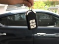 Bought a new car. A man holding car key - PhotoDune Item for Sale