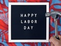 A man holding hammer together with Happy Labor Day sign board. Work hard play hard. - PhotoDune Item for Sale