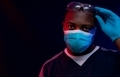 African American man acting as doctor or healthcare provider wearing blue mask gloves and protective - PhotoDune Item for Sale
