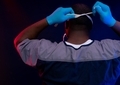 Doctor putting on mask wearing blue gloves in scrubs  - PhotoDune Item for Sale