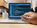 African American man using computer, computer code displayed on screen, programming, nerd culture - PhotoDune Item for Sale
