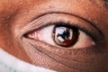 Close up of African American man’s eye wearing mask - PhotoDune Item for Sale