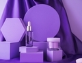 Hyaluronic acid bottle on very peri purple background displayed on geometric shape podiums on silk  - PhotoDune Item for Sale