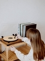 Girl puts a vintage record on a vinyl player to listen to music - PhotoDune Item for Sale