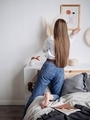 Girl with long hair hangs the frame on the wall - PhotoDune Item for Sale