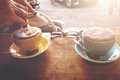 A man pouring sugar into a cappuccino  - PhotoDune Item for Sale