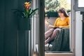 Woman reading a book on cosy balcony - PhotoDune Item for Sale