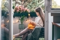 Woman knitting sweater on cosy balcony - PhotoDune Item for Sale