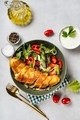 Close up of a plate with baked cod fillet with salad - PhotoDune Item for Sale