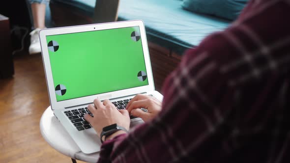 Closeup of Hipster Freelancer Male Hands Using Green Screen Chroma Key Laptop Typing Working in