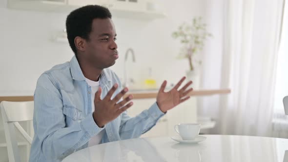 Disappointed African Man Feeling Worried at Home 