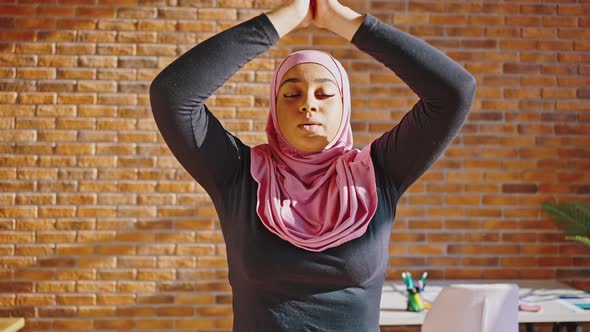 Close Portrait of Lovely Muslim Woman Doing Yoga Asana