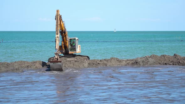 Sand is Being Dug Into the Beach