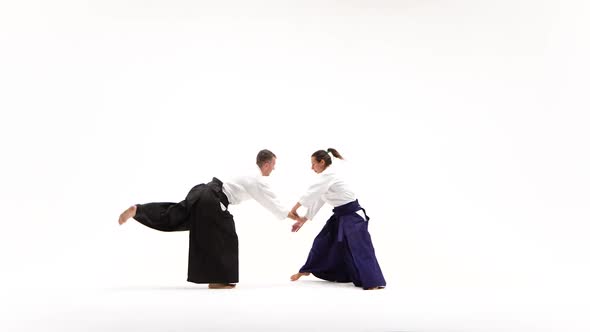Male, Female in Kimono Performing Aikido Techniques, Isolated on White