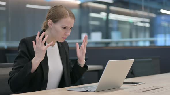 Businesswoman Feeling Angry While Using Laptop