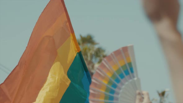 Slow motion of the pride flag waving during a pride parade