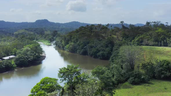 Aerial Drone View of Rainforest River and Mountains Scenery in Costa Rica at Boca Tapada, San Carlos