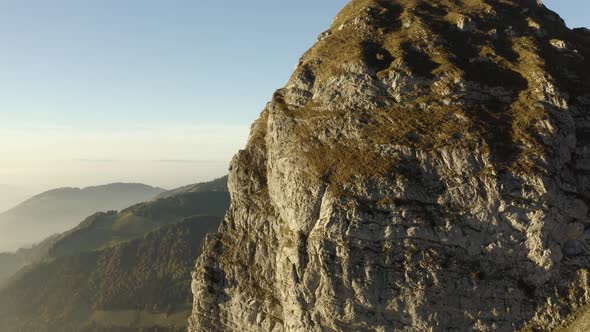 Climbing along steep limestone summit (Dent de Jaman) in the Swiss prealps near "Les Rochers de Naye