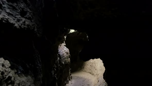 Speleology, cave, dungeon, dark tunnel, underground excavations. The old cave is formed by water