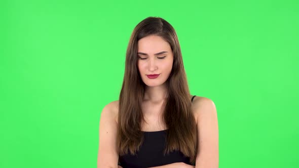 Lovely Female Stands Offended and Then Smiles. Green Screen