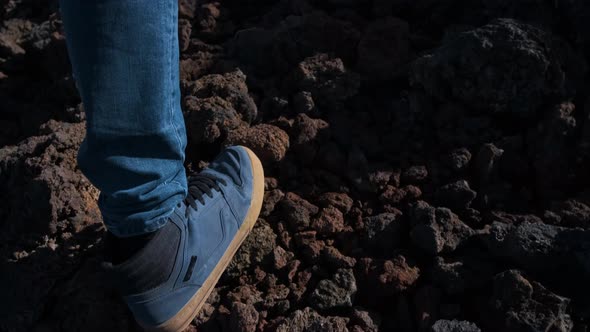 Close Up Shot of Tourist Man Walk Through the Mountains of Solidified Lava in the Teide Volcano