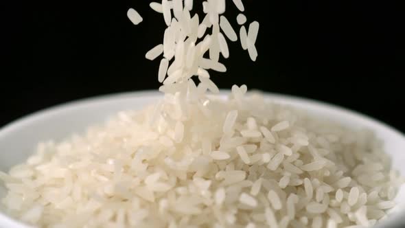 Pouring rice into plate, Slow Motion
