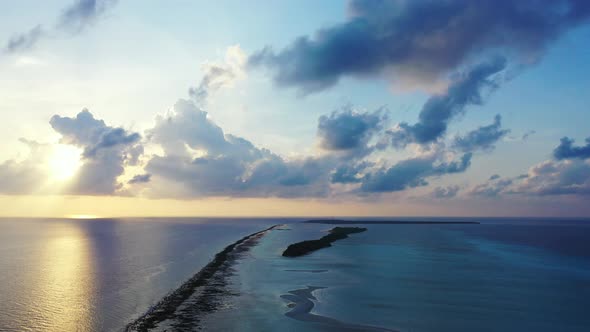 Cinematic sunrise over the open ocean near Barbados. Colorful horizon, sun reflecting on the calm wa