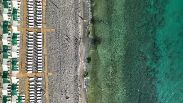 Empty sun loungers on the beach aerial view 4 K Turkey Alanya