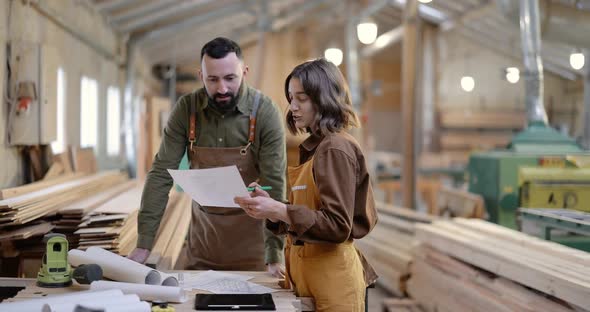 Carpentry Workers Designing at the Joinery