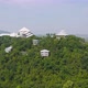 Aerial view of Thai village, hotel resort on green mountain hills with forest trees, Ratchaburi, - VideoHive Item for Sale