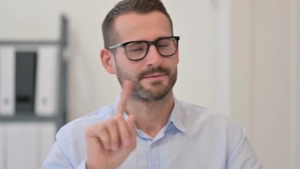 Portrait of Middle Aged Man Showing No Sign By Finger