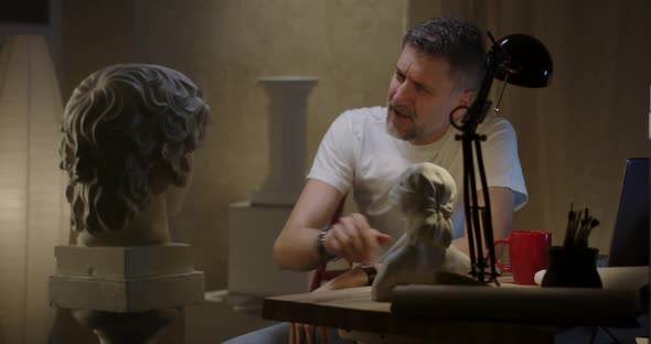 Artist Talking To Sculpture