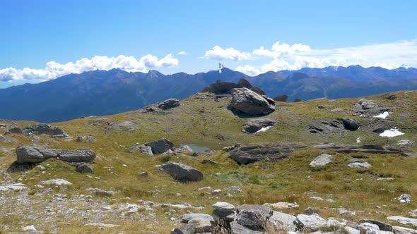 PAN: Alpine landscape high altitude mountain range and glaciers, green valley, snowcapped mountains