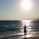 Aerial Drone Footage of a Girl Spreading Her Arms Feeling Like a Queen at a Beautiful Beach - VideoHive Item for Sale