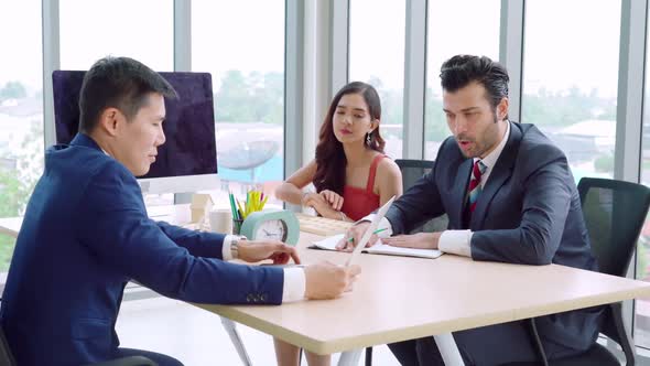 Smart Businessman and Businesswoman Talking Discussion in Group Meeting