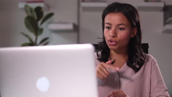 Woman Holds an Online Meeting on Computer in Office Spbi