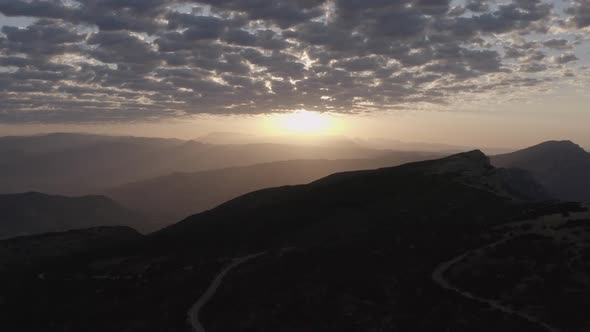 Sunset sky over mountain ridge in highland